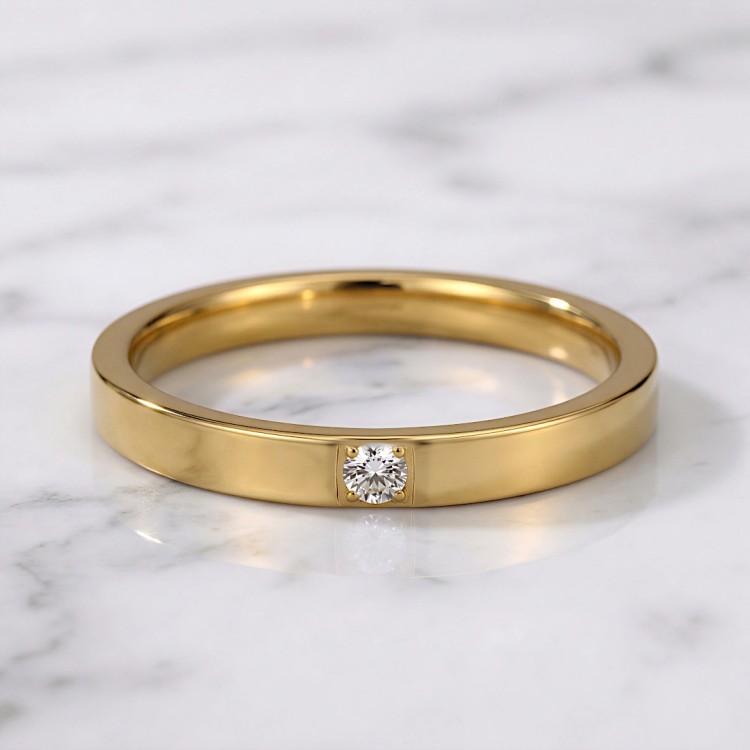 Cienka złota obrączka stalowa z cyrkonią.jpg