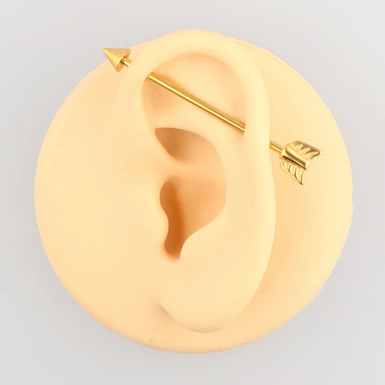 Złota sztanga stalowa industrial w kształcie strzały.jpg