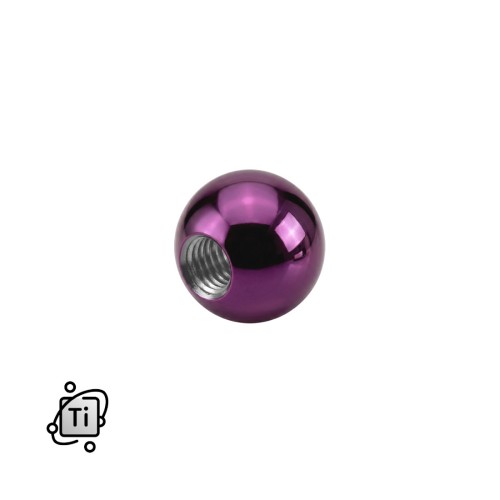 Fioletowa nakrętka z tytanowa na pręty z gwintem zewnętrznym.