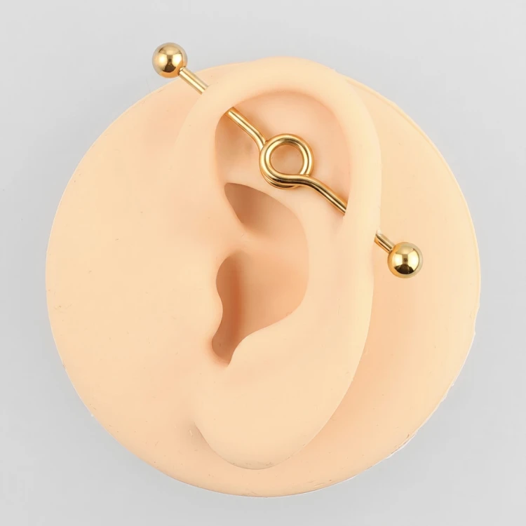 Złota sztanga stalowa industrial ze spiralnym kółkiem