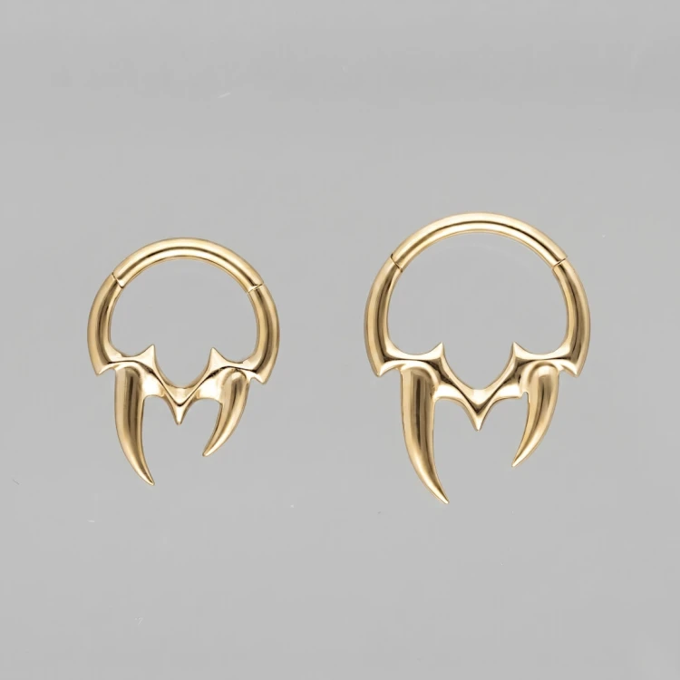 Złoty tytanowy clicker z motywem kłów