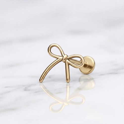 Złoty labret tytanowy w kształcie kokardki